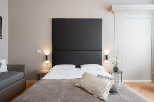Posteľ alebo postele v izbe v ubytovaní Hotel Palazzo Martinelli Dolfin