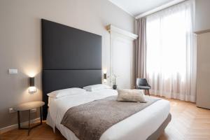 Posteľ alebo postele v izbe v ubytovaní Hotel Palazzo Martinelli Dolfin