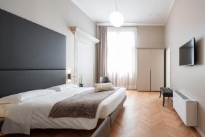 Posteľ alebo postele v izbe v ubytovaní Hotel Palazzo Martinelli Dolfin