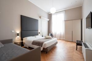Posteľ alebo postele v izbe v ubytovaní Hotel Palazzo Martinelli Dolfin