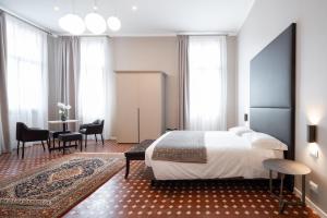 Posteľ alebo postele v izbe v ubytovaní Hotel Palazzo Martinelli Dolfin