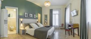 a bedroom with a bed and a desk in it at Grand Canal Suite by Wonderful Italy in Venice