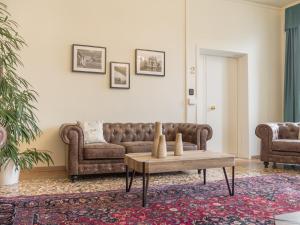 a living room with a couch and a table at Grand Canal Suite by Wonderful Italy in Venice