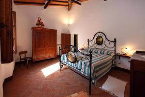 Postel nebo postele na pokoji v ubytování Agriturismo Torrenieri da Alessandro
