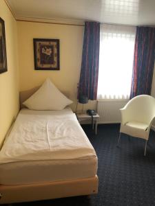 Postel nebo postele na pokoji v ubytování Hotel Albus