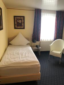 
Ein Bett oder Betten in einem Zimmer der Unterkunft Hotel Albus
