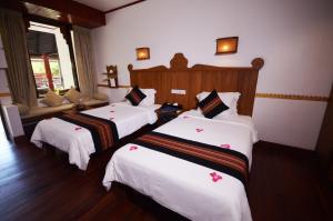 En eller flere senger på et rom på Hotel Amazing Nyaung Shwe
