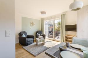 Posezení v ubytování Nordsee-Hotel Hinrichsen