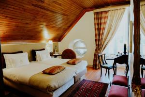 Cama ou camas em um quarto em Challet Fonte Nova
