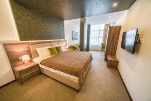 Кровать или кровати в номере Boutique Hotel "Salina"