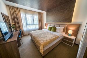 Кровать или кровати в номере Boutique Hotel "Salina"