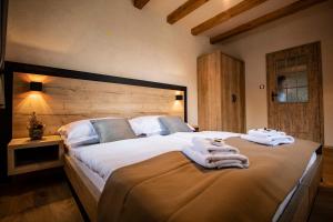 Postel nebo postele na pokoji v ubytování Residence Klažary u Žumberka