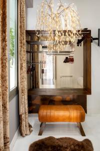 a dining room with a bench and a chandelier at Spectacular by Sebastiana Group in San Sebastián