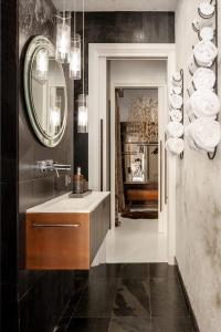 a bathroom with a sink and a mirror at Spectacular by Sebastiana Group in San Sebastián