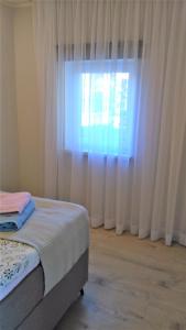 Posteľ alebo postele v izbe v ubytovaní Apartament Słoneczny