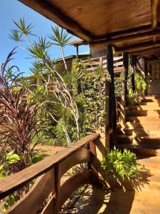 a wooden fence in front of a house at Jasy Hotel in Puerto Iguazú