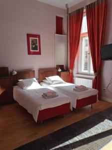 Posteľ alebo postele v izbe v ubytovaní Chopin Boutique