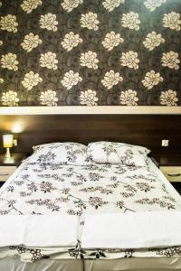 Кровать или кровати в номере Hotel Impressa