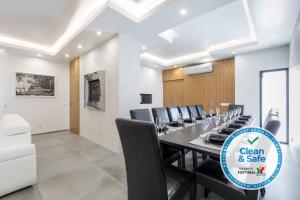 a conference room with a long table and chairs at Luxury 47 in Albufeira +70 photos