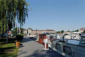 a bunch of boats are docked in a marina at appartcathedrale in Écrouves