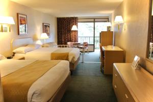 Postel nebo postele na pokoji v ubytování Impala Island Inn