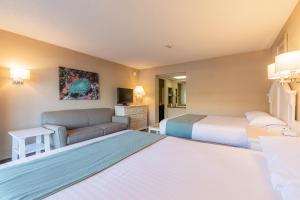 Postel nebo postele na pokoji v ubytování Impala Island Inn