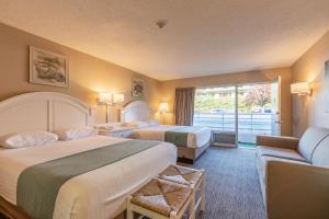 Postel nebo postele na pokoji v ubytování Impala Island Inn