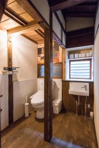 a bathroom with a toilet and a sink at DOT HOUSE NAGANO Traditional Japanese house - Vacation STAY 82102 in Nagano