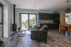 a living room with a couch and a table at AenBetje in Goedereede