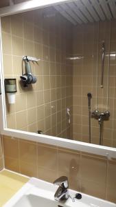 a bathroom with a sink and a large mirror at Majoitus Hermanni in Teuva +17 photos
