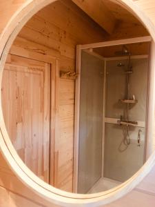anorthole view of a shower in a wooden room at LODGE 5 Zandvoort in Zandvoort +27 photos