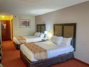 a hotel room with two beds in a room at Motel 6 Elkhart, IN in Elkhart