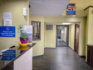 a hallway of a hospital with a reception desk and a hallwayngthngthngthngth at Motel 6 Elkhart in Elkhart