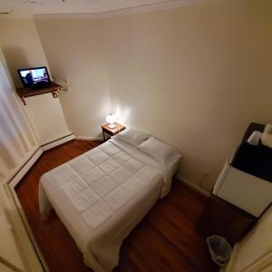 Llit o llits en una habitació de Cappuccio Hotel