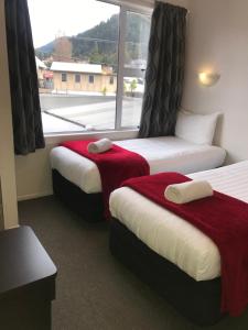 Un pat sau paturi într-o cameră la Amber Lodge