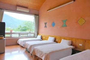 Postel nebo postele na pokoji v ubytování Ying Tian Ye Homestay