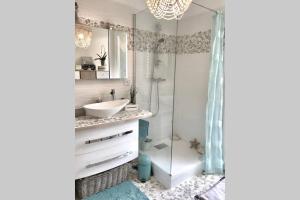 a bathroom with a sink and a shower at ANTINEA in Cassis +26 photos
