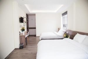 Postel nebo postele na pokoji v ubytování Pontus Hotel
