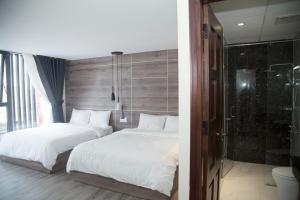 Postel nebo postele na pokoji v ubytování Pontus Hotel