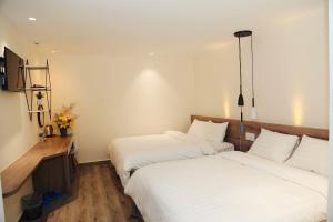 Postel nebo postele na pokoji v ubytování Pontus Hotel