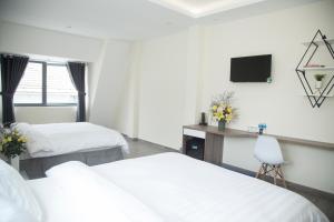 Postel nebo postele na pokoji v ubytování Pontus Hotel