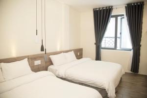 Postel nebo postele na pokoji v ubytování Pontus Hotel