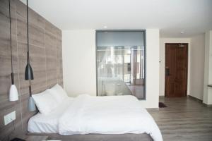 Postel nebo postele na pokoji v ubytování Pontus Hotel