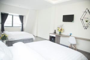 Postel nebo postele na pokoji v ubytování Pontus Hotel