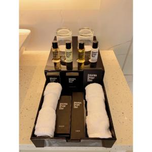 a box with some bottles of wine and towels at Marina Point Bay Resort in Panglao Island