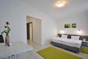 Postel nebo postele na pokoji v ubytování Hotel Roztocze