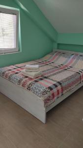 Кровать или кровати в номере Apartments Maja