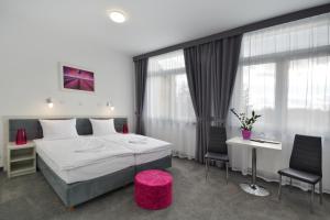 Postel nebo postele na pokoji v ubytování Hotel Roztocze