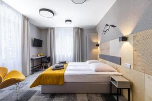 Posteľ alebo postele v izbe v ubytovaní KRISTINA Willa & Spa