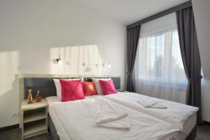 Postel nebo postele na pokoji v ubytování Hotel Roztocze